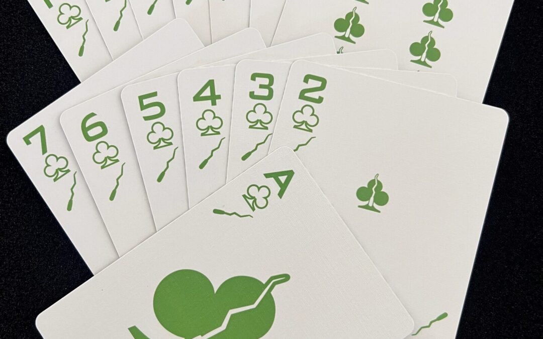 Fan of the Ikonology clubs suit in green, each card also marked with the tarot wands symbol