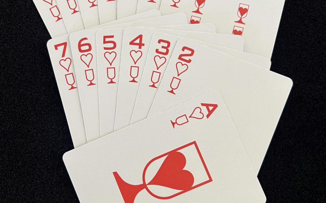 Fan of the Ikonology hearts suit in red, each card also marked with the tarot cups symbol